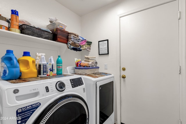 clothes washing area with washing machine and clothes dryer