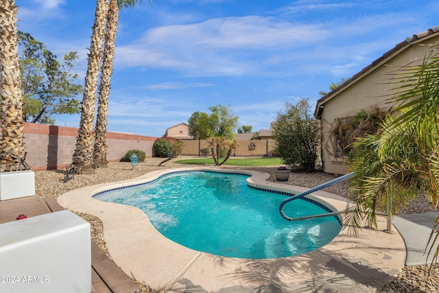 view of swimming pool with a patio