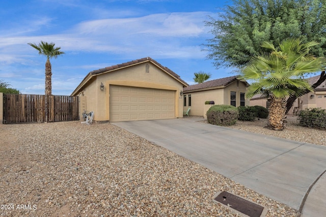 ranch-style home featuring a garage