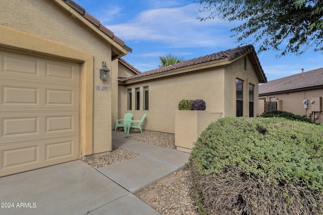 entrance to property featuring a garage