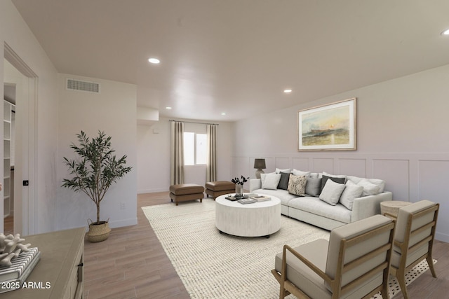 5132 N 83rd St, Scottsdale, AZ 85250 - living room with light wood-style floors, recessed lighting, and a wainscoted wall