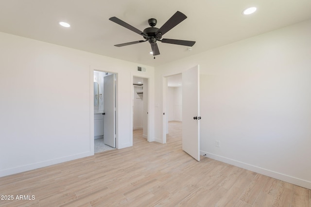 5132 N 83rd St, Scottsdale, AZ 85250 - unfurnished bedroom featuring baseboards, light wood finished floors, recessed lighting, a walk in closet, and ensuite bath