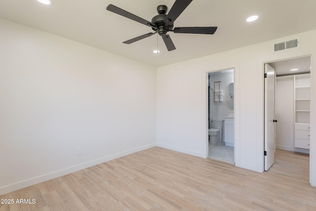 5132 N 83rd St, Scottsdale, AZ 85250 - unfurnished bedroom with a walk in closet, light wood-type flooring, baseboards, recessed lighting, and a closet
