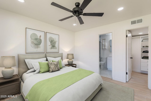 5132 N 83rd St, Scottsdale, AZ 85250 - bedroom with a walk in closet, recessed lighting, light wood finished floors, ensuite bathroom, and a ceiling fan