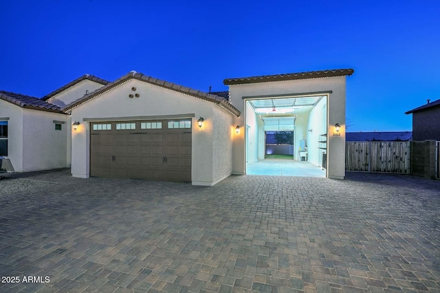 mediterranean / spanish-style house featuring a garage