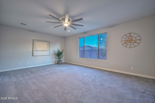 spare room with ceiling fan and carpet floors