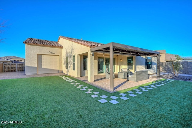 back of house with a yard and a patio