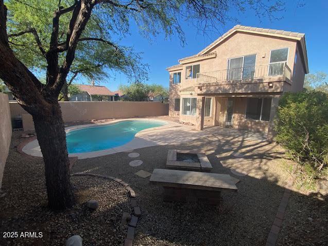 view of swimming pool with a fenced backyard, a patio, and a fenced in pool