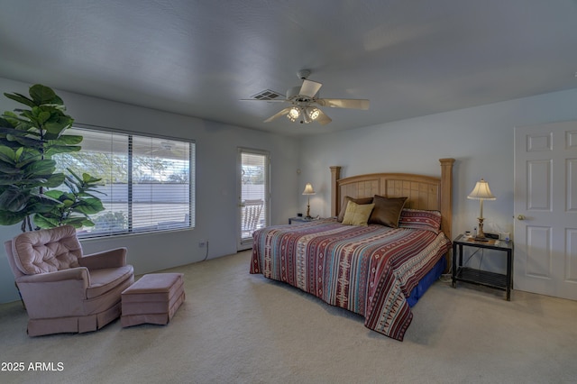 bedroom with ceiling fan and light carpet