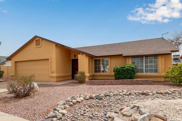 ranch-style home featuring a garage, driveway, a shingled roof, and stucco siding