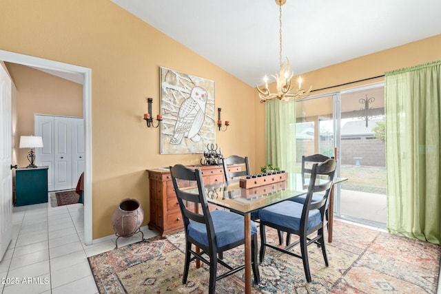 dining space with lofted ceiling, a notable chandelier, and light tile patterned floors