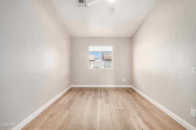 spare room featuring light wood-type flooring and ceiling fan