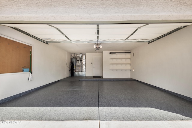 garage with a garage door opener and water heater