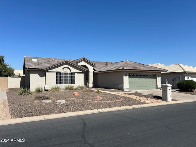 single story home with a garage