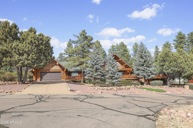 log-style house with a garage