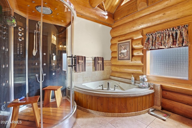 bathroom with tile patterned floors and a washtub