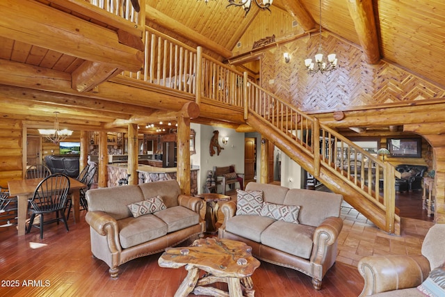 living room featuring beamed ceiling, hardwood / wood-style flooring, wooden ceiling, and an inviting chandelier