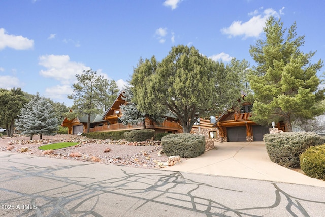 log home featuring a garage