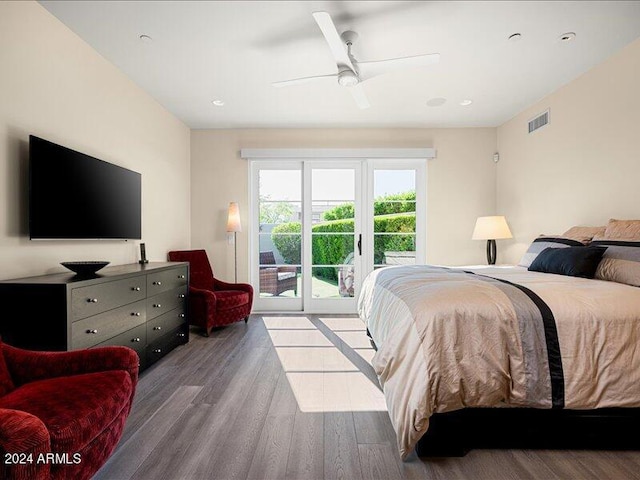 bedroom featuring ceiling fan, dark hardwood / wood-style flooring, and access to exterior