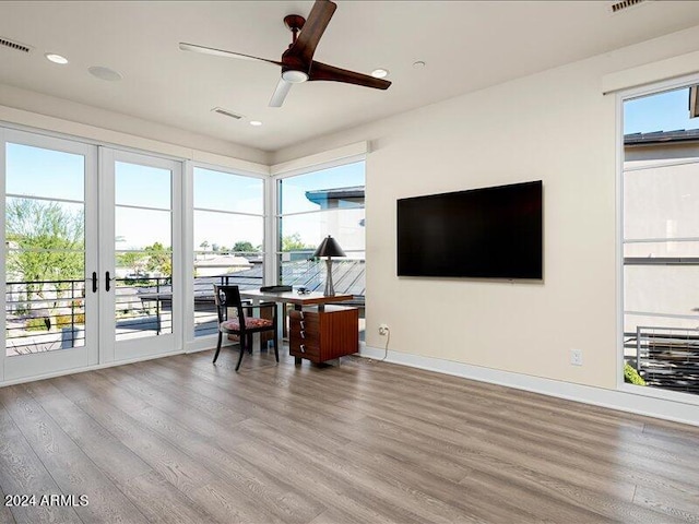 office space with french doors, wood-type flooring, and ceiling fan