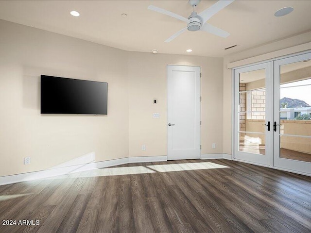 spare room featuring french doors, ceiling fan, and dark hardwood / wood-style floors