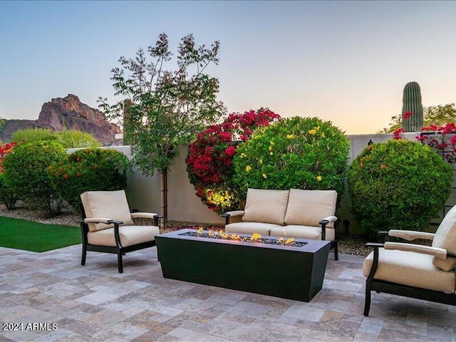 patio terrace at dusk with an outdoor living space