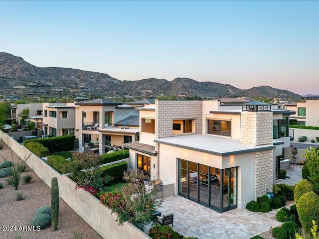 view of front of home featuring a mountain view