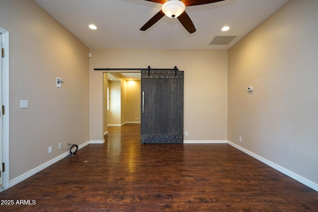 1301 N Santa Rosa Ave, Tucson, AZ 85712 - spare room featuring a ceiling fan, visible vents, recessed lighting, a barn door, and wood finished floors
