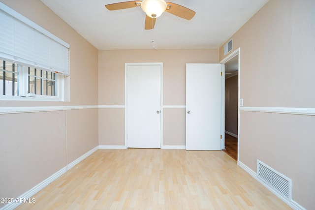 1301 N Santa Rosa Ave, Tucson, AZ 85712 - unfurnished bedroom featuring visible vents, baseboards, and wood finished floors