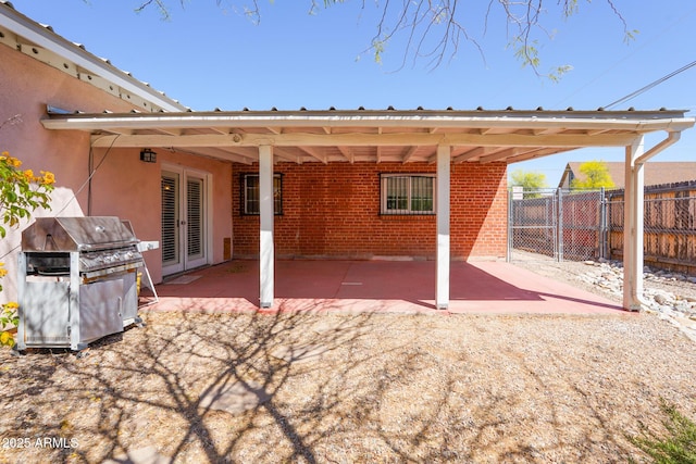 1301 N Santa Rosa Ave, Tucson, AZ 85712 - view of patio with grilling area, french doors, fence, and a gate