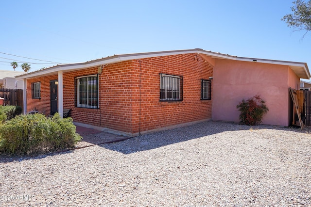 1301 N Santa Rosa Ave, Tucson, AZ 85712 - exterior space featuring stucco siding and fence