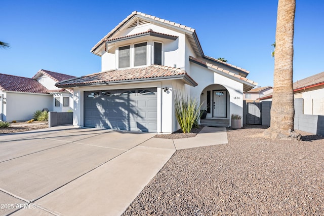 mediterranean / spanish house featuring a garage