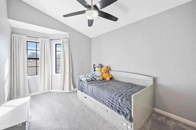 carpeted bedroom featuring vaulted ceiling and ceiling fan