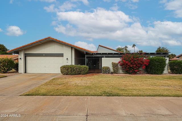 view of front facade with a front lawn and a garage