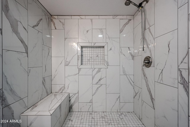 bathroom featuring tiled shower