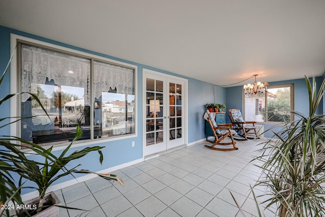 interior space featuring an inviting chandelier and french doors