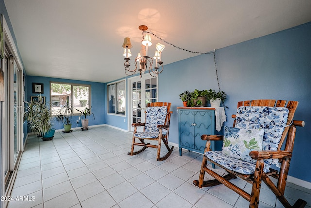 living area featuring light tile patterned floors and an inviting chandelier