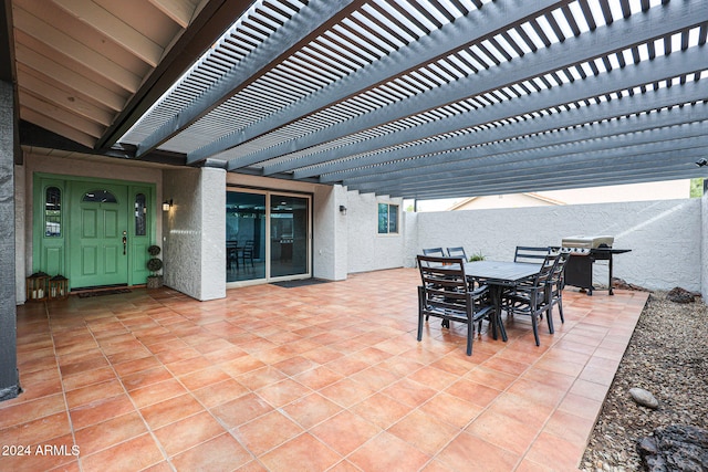 view of patio / terrace with area for grilling and a pergola