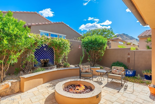 view of patio / terrace featuring an outdoor fire pit