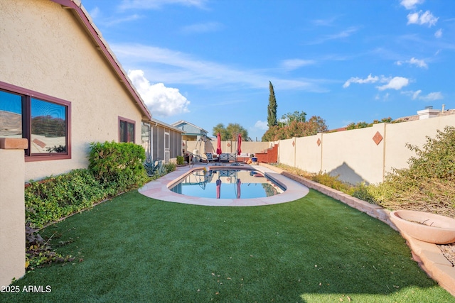 view of pool with a yard and a patio area