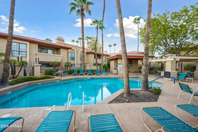 view of pool with a patio and a pergola