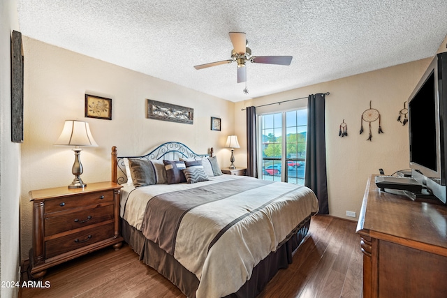 bedroom with a textured ceiling, access to outside, dark hardwood / wood-style floors, and ceiling fan