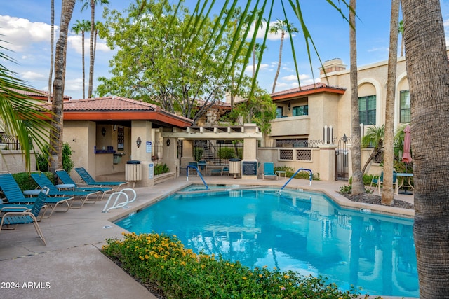 view of swimming pool with a patio area