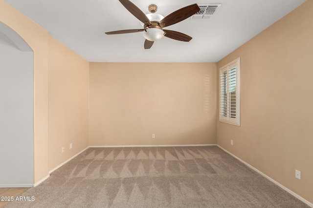 unfurnished room featuring ceiling fan and light colored carpet