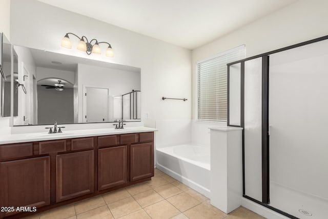 bathroom featuring ceiling fan, tile patterned floors, vanity, and independent shower and bath