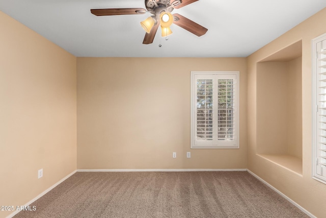 empty room with carpet and ceiling fan