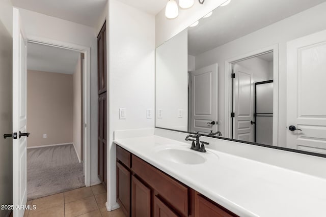 bathroom with tile patterned floors and vanity