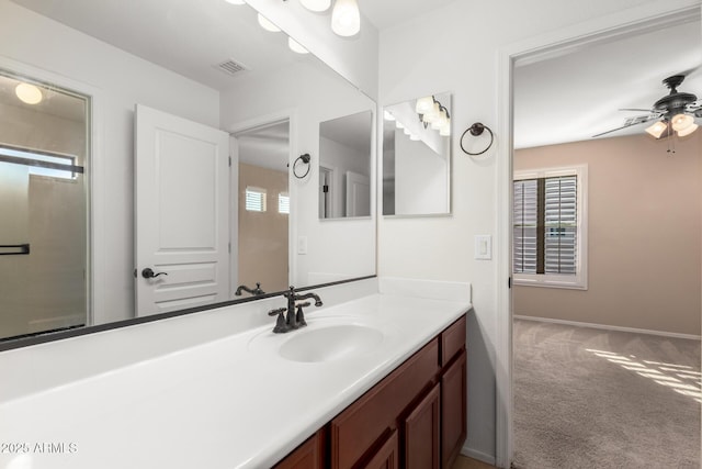 bathroom with ceiling fan and vanity