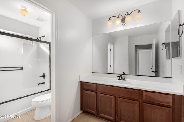 full bathroom with toilet, bath / shower combo with glass door, tile patterned floors, and vanity