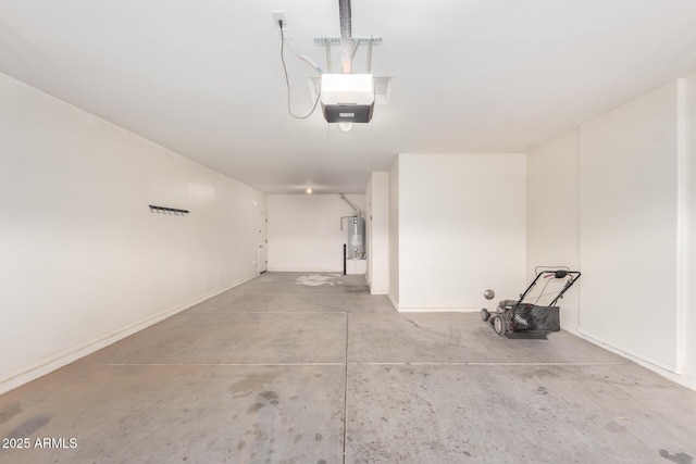 garage featuring water heater and a garage door opener